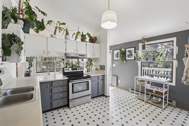 1021 Lodge Pole Dr, Black Hawk, CO 80422 - kitchen featuring stainless steel electric range oven, under cabinet range hood, light countertops, white cabinetry, and lofted ceiling