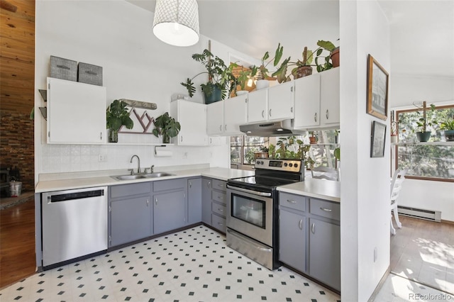 1021 Lodge Pole Dr, Black Hawk, CO 80422 - kitchen featuring stainless steel appliances, plenty of natural light, under cabinet range hood, and baseboard heating