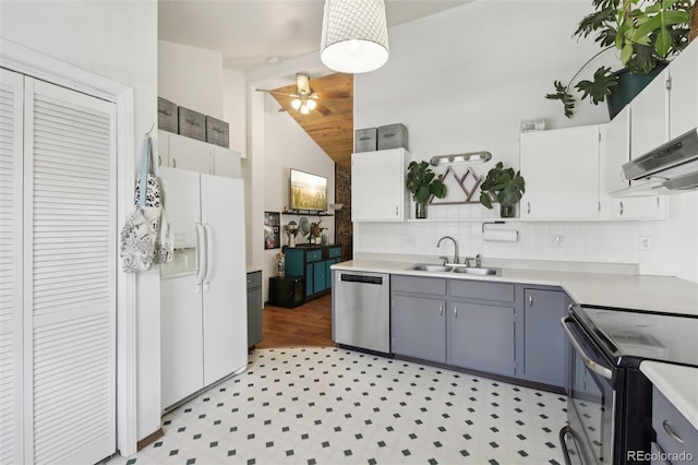 1021 Lodge Pole Dr, Black Hawk, CO 80422 - kitchen featuring appliances with stainless steel finishes, a ceiling fan, light countertops, vaulted ceiling, and tasteful backsplash