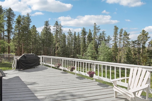 1021 Lodge Pole Dr, Black Hawk, CO 80422 - wooden terrace with area for grilling and a forest view