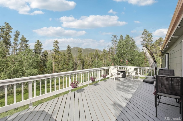 1021 Lodge Pole Dr, Black Hawk, CO 80422 - wooden deck with a view of trees and a mountain view