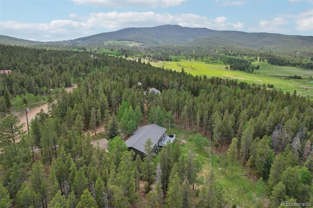 1021 Lodge Pole Dr, Black Hawk, CO 80422 - aerial view of property and surrounding area with a forest and a mountainous background