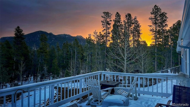 1021 Lodge Pole Dr, Black Hawk, CO 80422 - deck at dusk featuring a mountain view