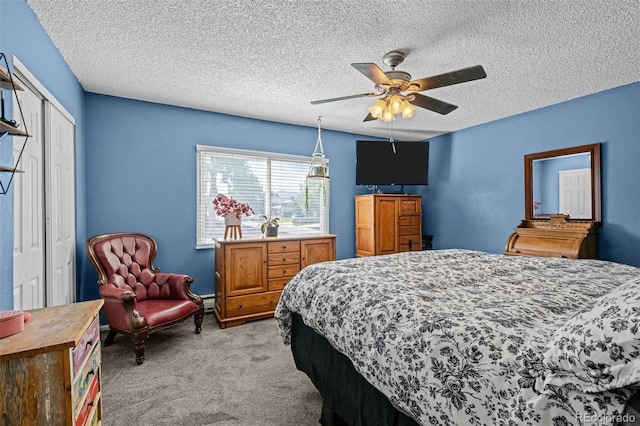4501 S Garrison St, Littleton, CO 80123 - bedroom with light colored carpet, a closet, a textured ceiling, and ceiling fan