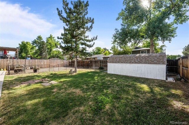 4501 S Garrison St, Littleton, CO 80123 - fenced backyard with a storage unit
