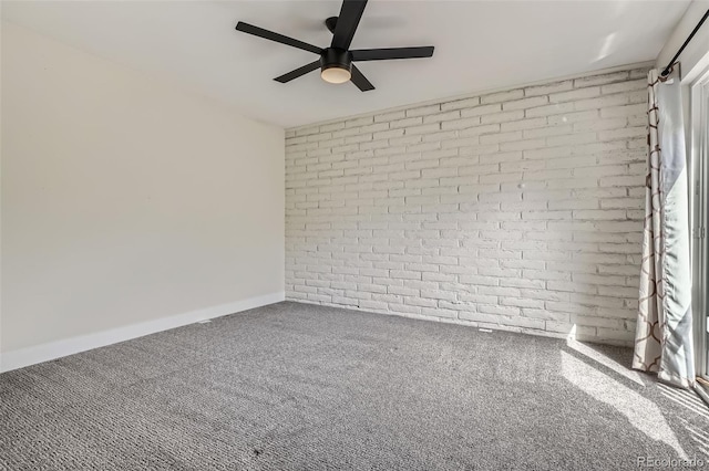 9605 E Kansas Cir Unit 53, Denver, CO 80247 - carpeted empty room with brick wall, ceiling fan, and baseboards