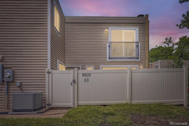9605 E Kansas Cir Unit 53, Denver, CO 80247 - view of side of property featuring cooling unit and a gate