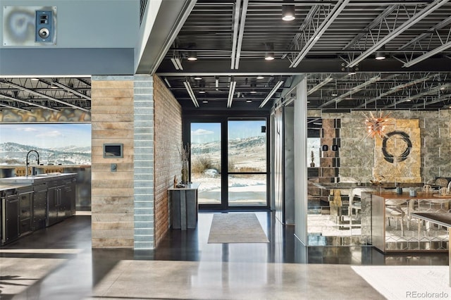 building lobby featuring a mountain view and a sink