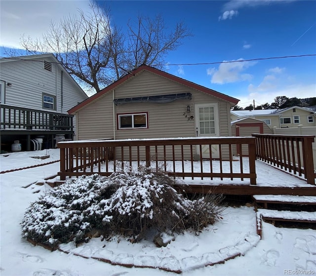 view of snow covered deck