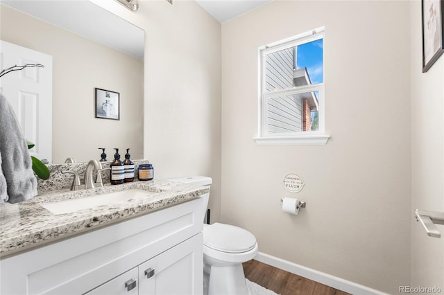 21535 E 39th Ave, Denver, CO 80249 - half bathroom with wood finished floors and vanity