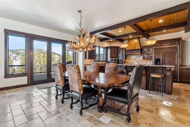 dining space with baseboards, beamed ceiling, stone tile flooring, french doors, and recessed lighting