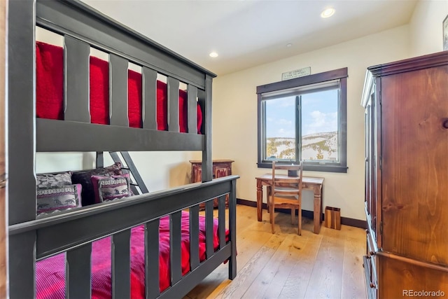 bedroom with recessed lighting, baseboards, and hardwood / wood-style floors