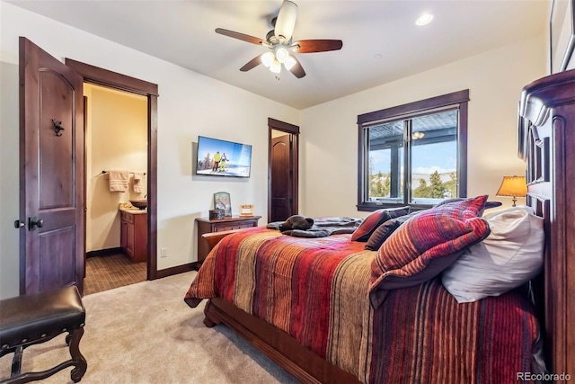 bedroom with light carpet, ceiling fan, and baseboards