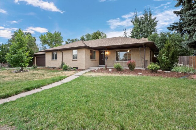 ranch-style home with a porch and a front lawn