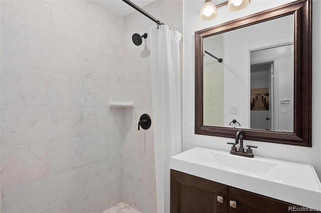 bathroom with vanity and walk in shower