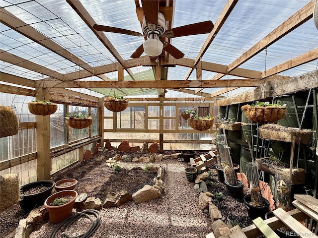 sunroom / solarium featuring ceiling fan