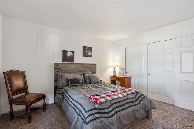 bedroom with carpet, baseboards, and a closet