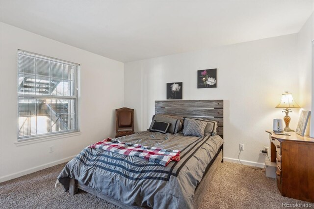 carpeted bedroom with baseboards