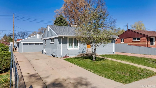 6981 Zuni St, Denver, CO 80221 - single story home featuring a detached garage, an outbuilding, a front yard, and brick siding