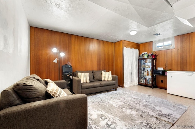 6981 Zuni St, Denver, CO 80221 - living area with wood walls and visible vents