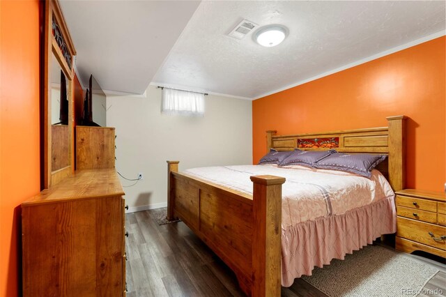 6981 Zuni St, Denver, CO 80221 - bedroom with visible vents, baseboards, and dark wood-style floors