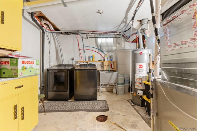 6981 Zuni St, Denver, CO 80221 - utility room featuring washing machine and clothes dryer, heating unit, and water heater