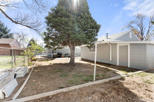 6981 Zuni St, Denver, CO 80221 - view of yard featuring a trampoline and fence