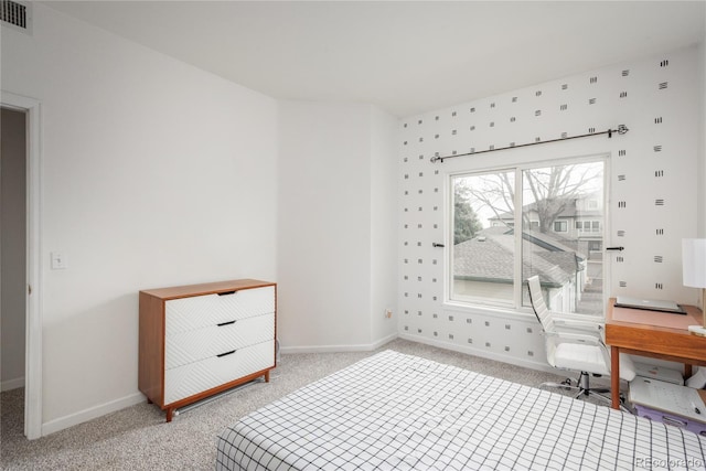 8707 E Florida Ave Unit 510, Denver, CO 80247 - bedroom featuring baseboards, light carpet, and visible vents