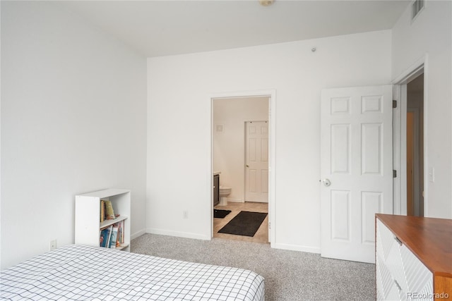 8707 E Florida Ave Unit 510, Denver, CO 80247 - bedroom with carpet floors, baseboards, visible vents, and ensuite bath