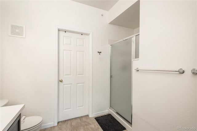8707 E Florida Ave Unit 510, Denver, CO 80247 - full bath featuring vanity, toilet, baseboards, a shower stall, and visible vents