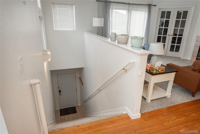 8707 E Florida Ave Unit 510, Denver, CO 80247 - stairway featuring visible vents, baseboards, wood finished floors, and french doors