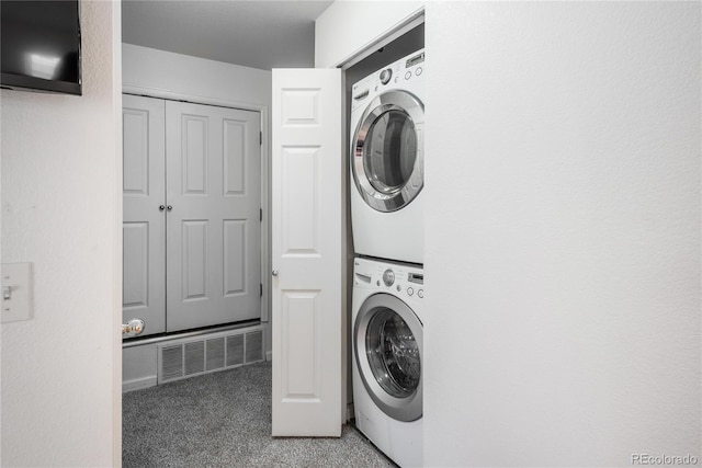 8707 E Florida Ave Unit 510, Denver, CO 80247 - washroom featuring laundry area, stacked washing maching and dryer, light carpet, and visible vents