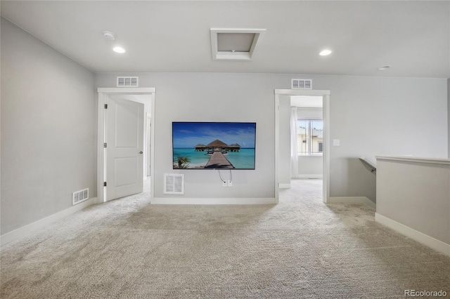 unfurnished living room featuring light carpet