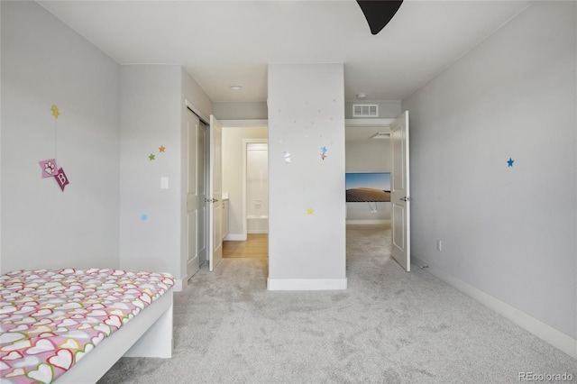 unfurnished bedroom featuring light colored carpet