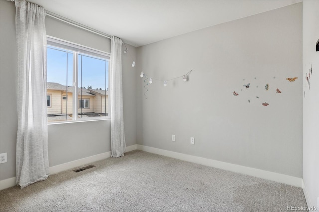 empty room with carpet flooring