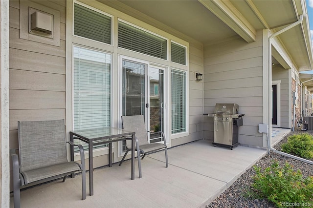 view of patio / terrace with a grill and cooling unit