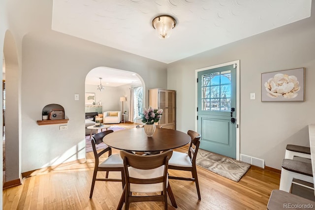 dining area with light hardwood / wood-style flooring