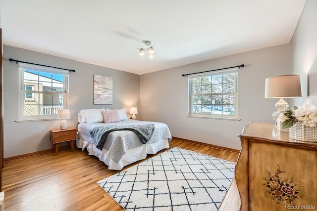 bedroom with wood-type flooring