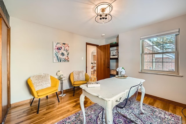 home office with hardwood / wood-style flooring