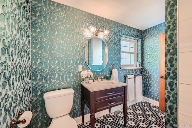 bathroom featuring vanity and toilet