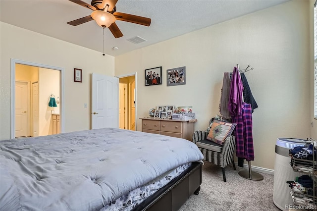 bedroom featuring baseboards, carpet floors, visible vents, and a ceiling fan