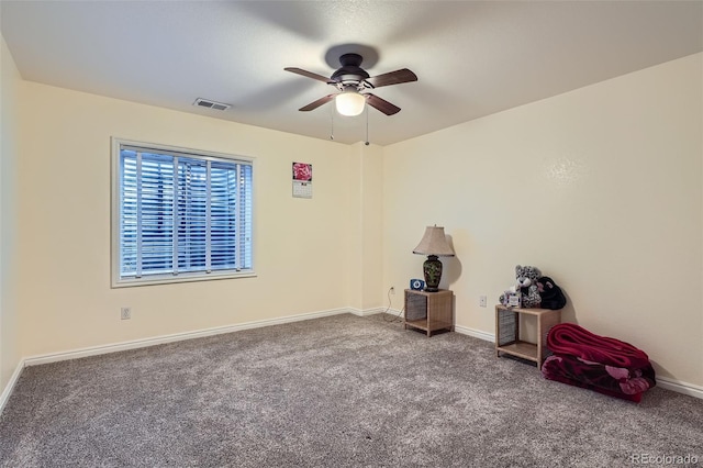 interior space featuring carpet, visible vents, and baseboards