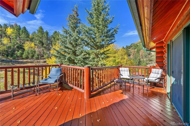 3115 State Highway 9, Guffey, CO 80820 - wooden terrace featuring a view of trees