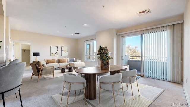 2500 E Cherry Creek S Drive 213, Denver, CO 80209 - dining space featuring plenty of natural light and light carpet