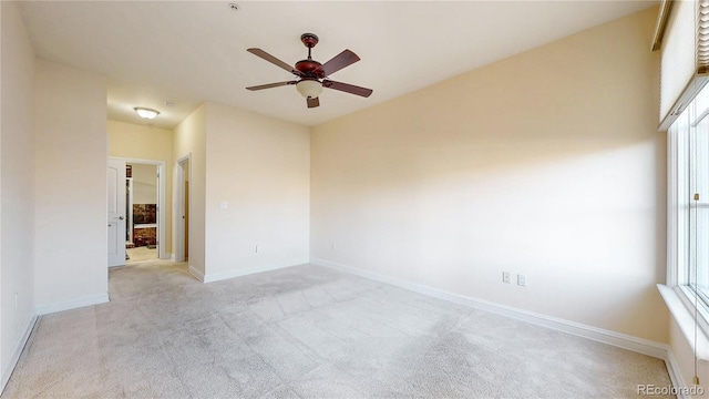 2500 E Cherry Creek S Drive 213, Denver, CO 80209 - unfurnished room featuring light carpet, ceiling fan, and baseboards