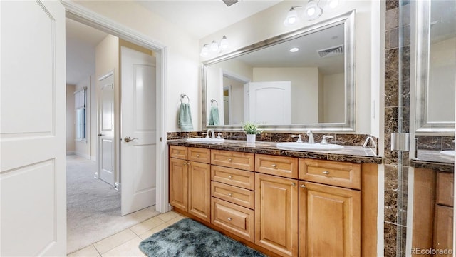 2500 E Cherry Creek S Drive 213, Denver, CO 80209 - full bathroom with double vanity and tile patterned floors