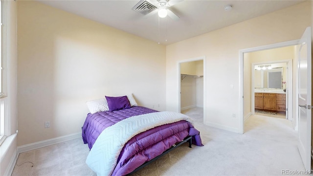 2500 E Cherry Creek S Drive 213, Denver, CO 80209 - bedroom featuring light carpet, a spacious closet, baseboards, and a closet