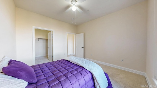 2500 E Cherry Creek S Drive 213, Denver, CO 80209 - bedroom with light colored carpet, baseboards, ceiling fan, and a closet