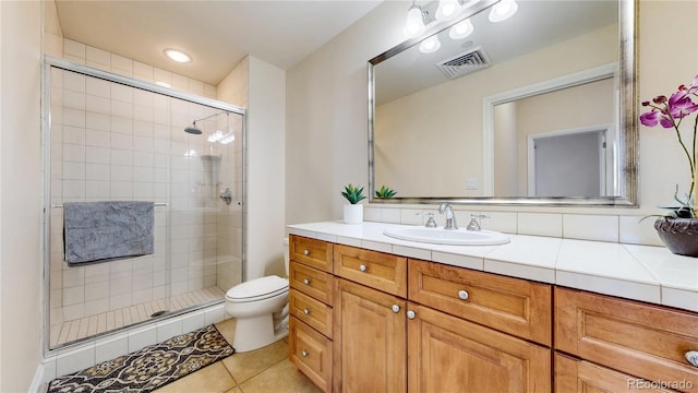 2500 E Cherry Creek S Drive 213, Denver, CO 80209 - full bathroom with a shower stall, vanity, toilet, and tile patterned flooring