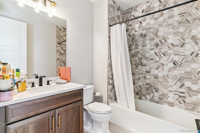 full bathroom with shower / tub combo with curtain, vanity, and toilet